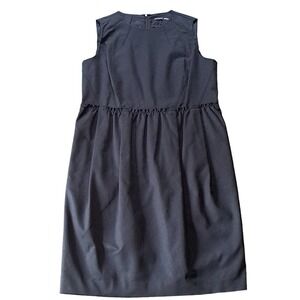 Magaschoni Collection black dress with pockets and zipper back. Size 16